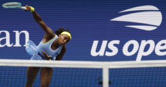 Coco Gauff serves.
