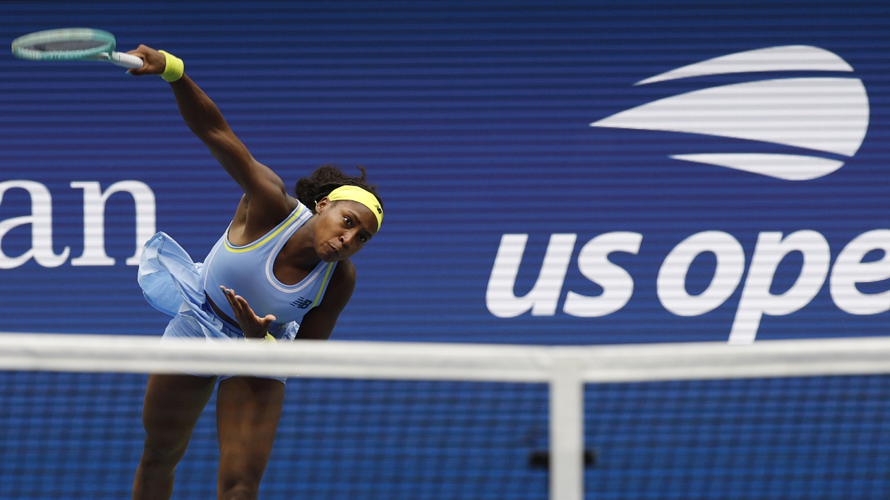 Coco Gauff serves.