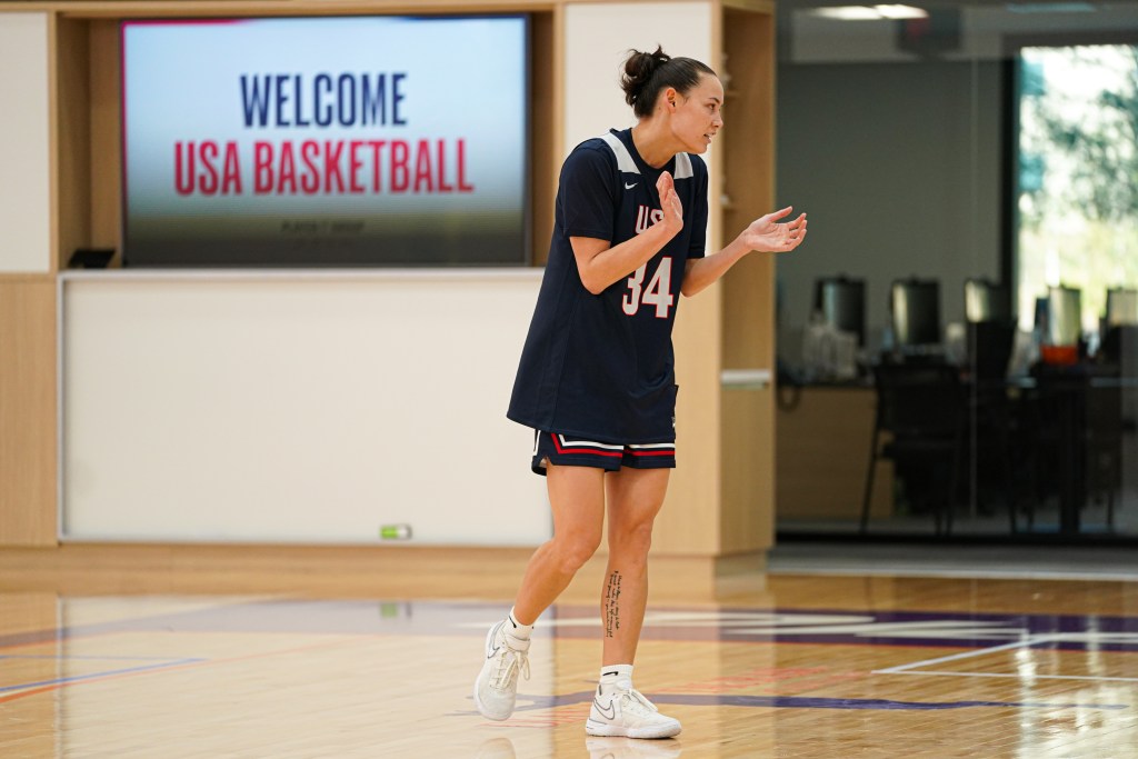 Abbey Hsu stands and claps during USA Basketball 3x3 camp