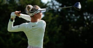 Nelly Korda follows through on a swing, teeing off with her driver