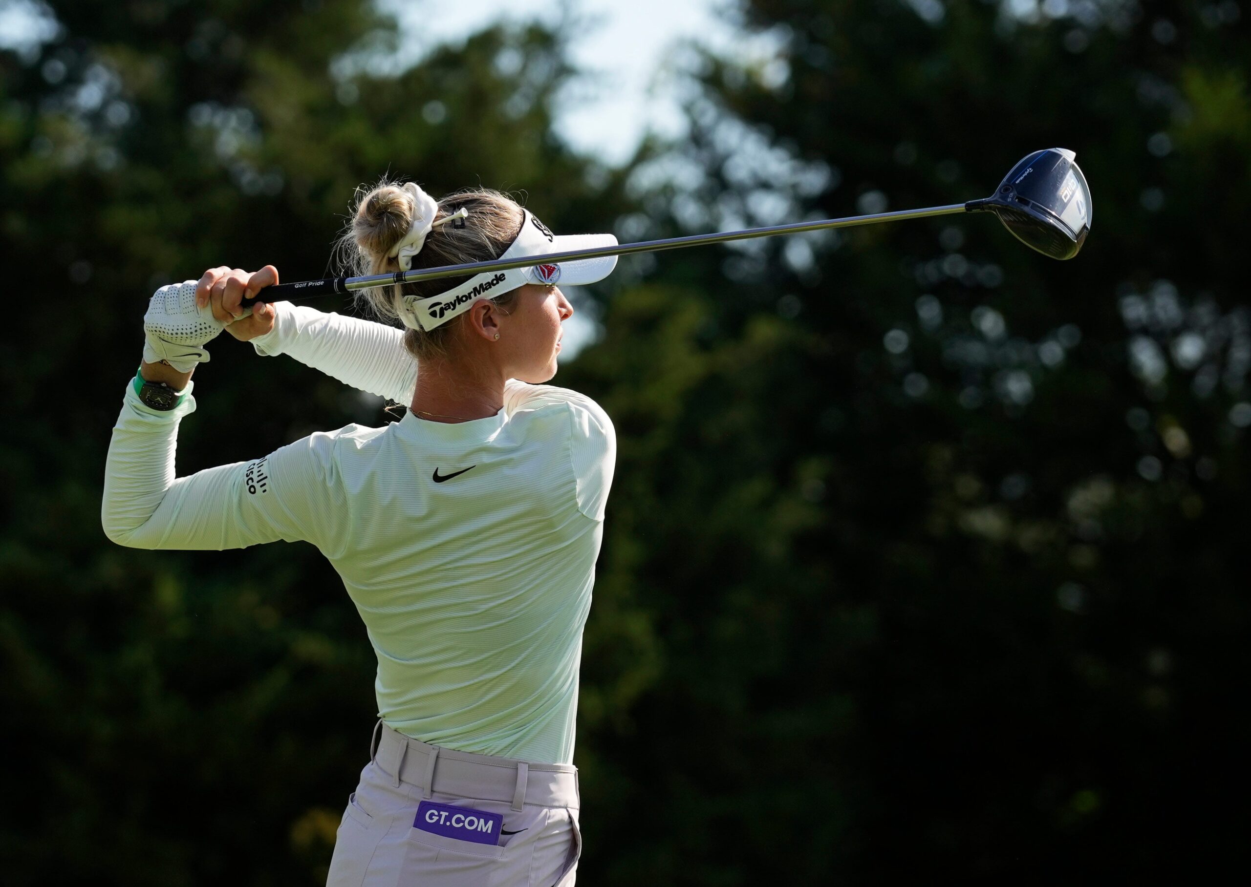 Nelly Korda follows through on a swing, teeing off with her driver