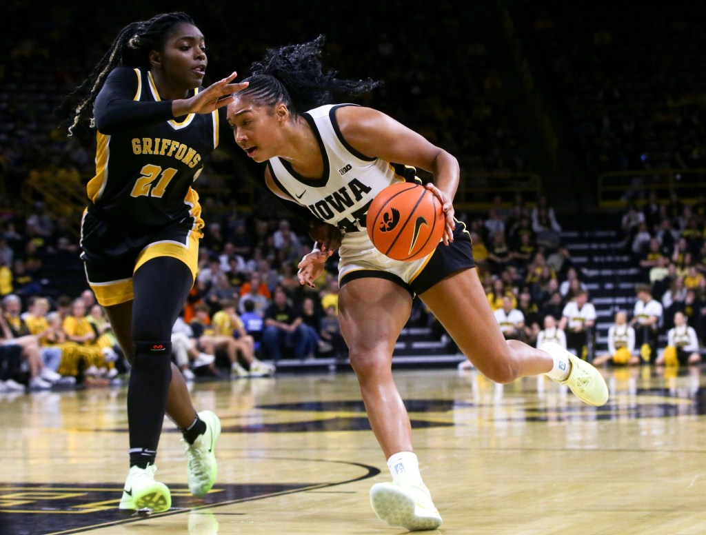 Iowa's Hannah Stuelke dribbles the ball toward the basket against Missouri Western.