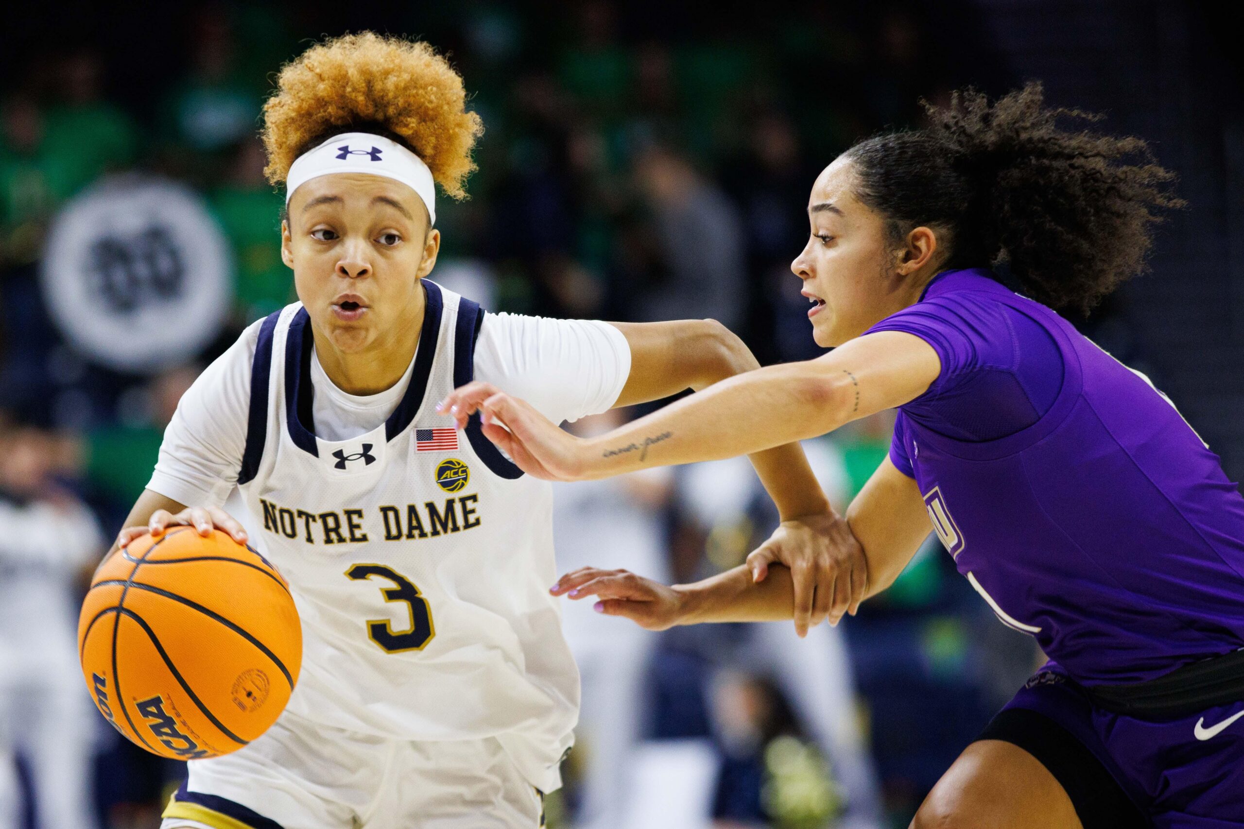 Hannah Hidalgo drives to the hoop.