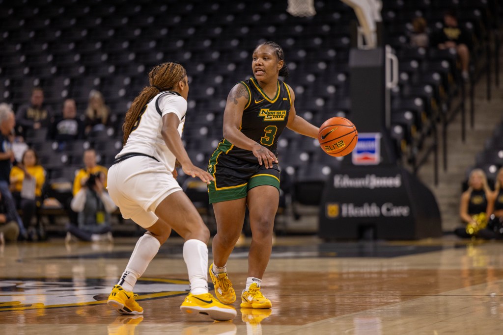 Norfolk State's Diamond Johnson brings the ball up the floor against a Missouri defender during a road game in Columbia, Mo. on Sunday, Nov. 17, 2024.
