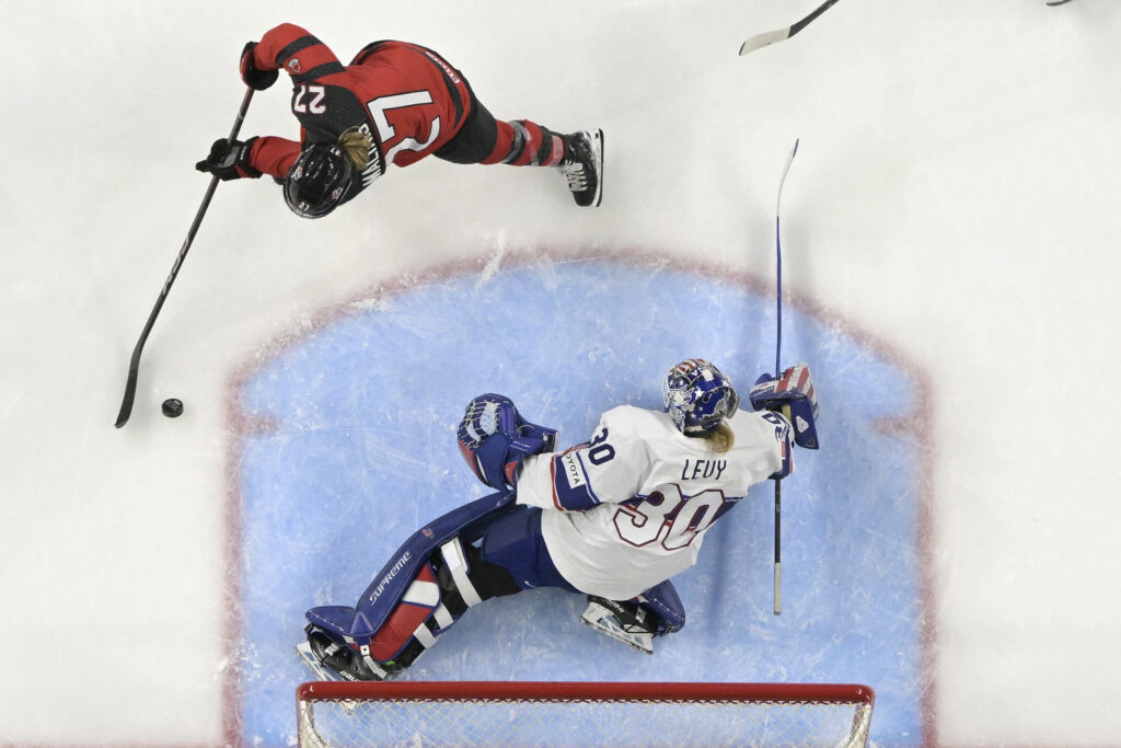Aerial photo of Team Canada forward Emma Maltais in on a breakaway towards a Team USA goalie
