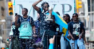 Jonquel Jones and company, celebrated at a parade.