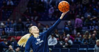Paige Bueckers shoots a layup.