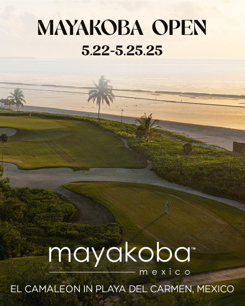 A golf course from an aerial view with the ocean and a sunset in the background