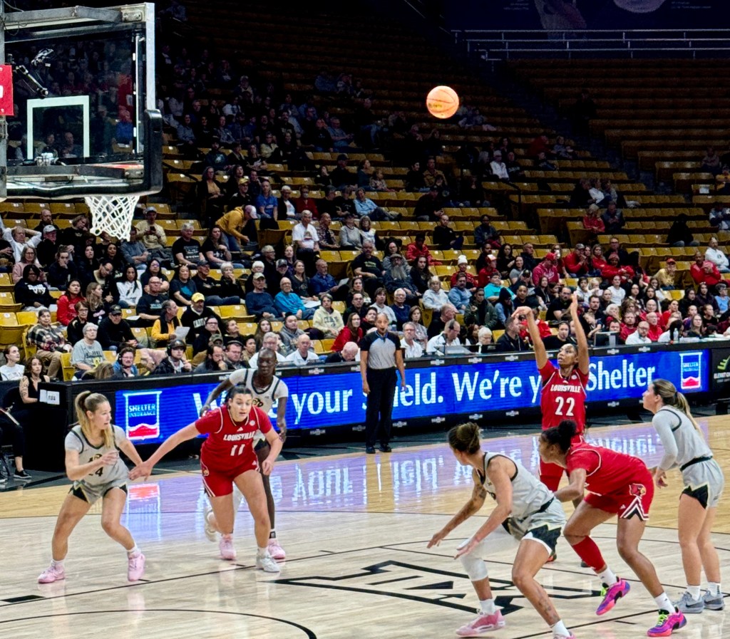 Louisville guard Tajianna Roberts shoots a free throw against Colorado in a basketball game played at the Colorado Events Center.