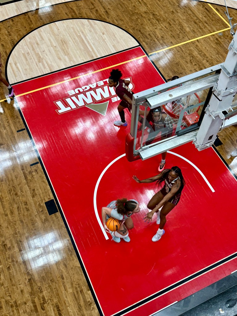 Jordan Jones of Denver dribbles the ball under the basket.