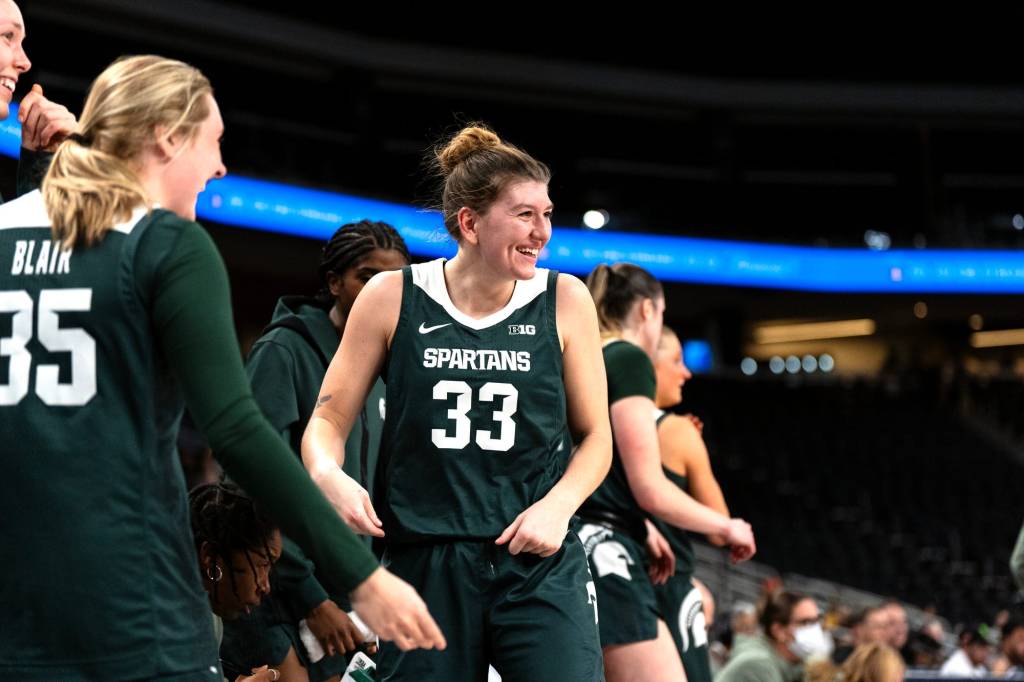 Michigan State players smile together