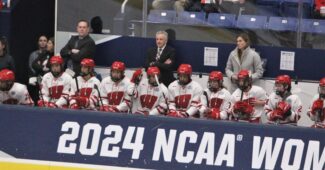 Wisconsin Badgers women's hockey team bench is pictured at the 2024 NCAA women's hockey national semifinal