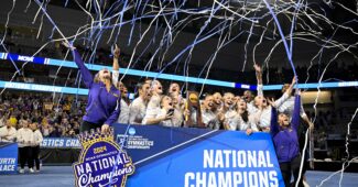 The LSU women's gymnastics team celebrates its victory at the 2024 NCAA championships.