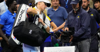 Iga Swiatek walks off the court at the 2024 U.S. Open