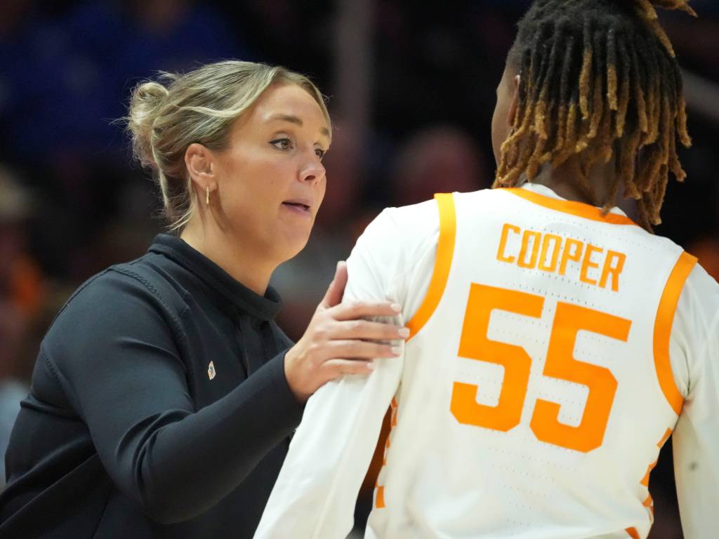Kim Caldwell puts a hand on Talaysia Cooper's left shoulder