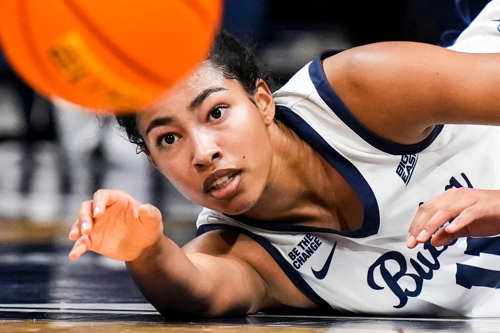 Butler's Kilyn McGuff dives after a basketball