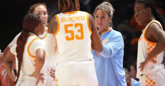 Kim Caldwell instructs her team.