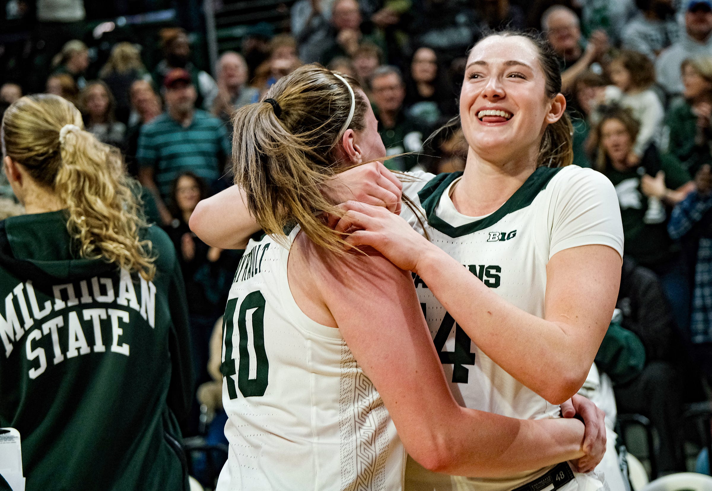 Grace VanSlooten (right) celebrates with Julia Ayrault after Michigan State's win over Iowa.