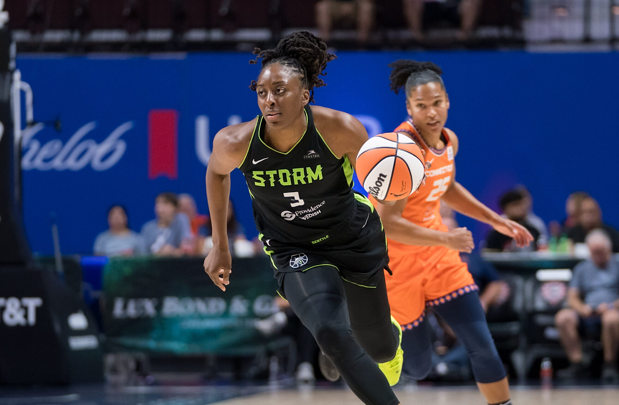 Seattle Storm forward Nneka Ogwumike dribbles up the court with her left hand.