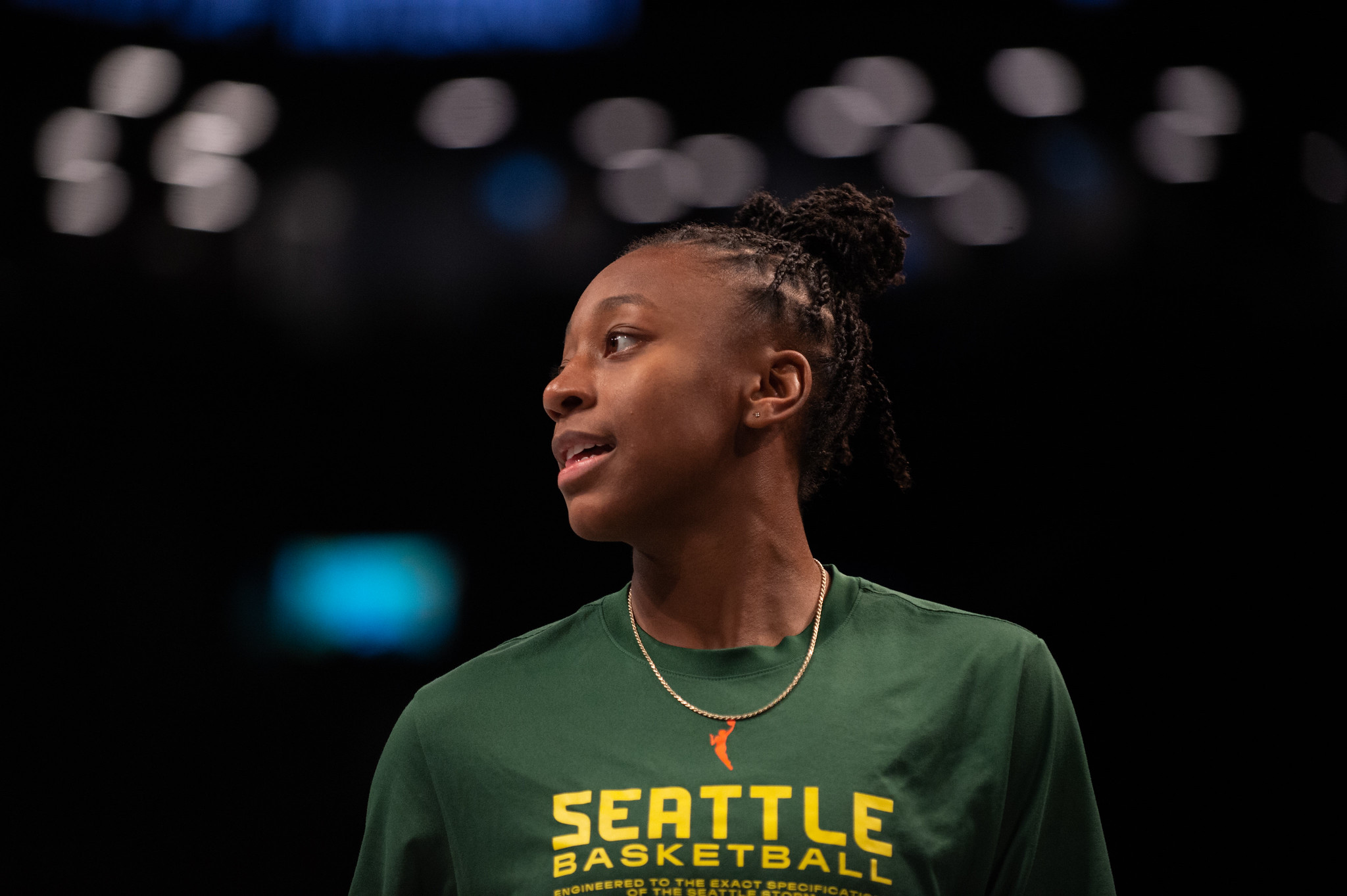 Seattle Storm guard Jewell Loyd is shown wearing a warmup shirt and looking off to her right.