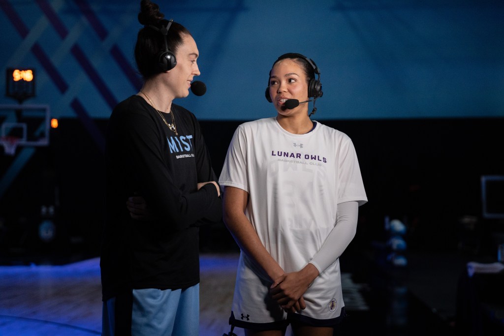 Breanna Stewart and Napheesa Collier stand with headsets on for an interview.