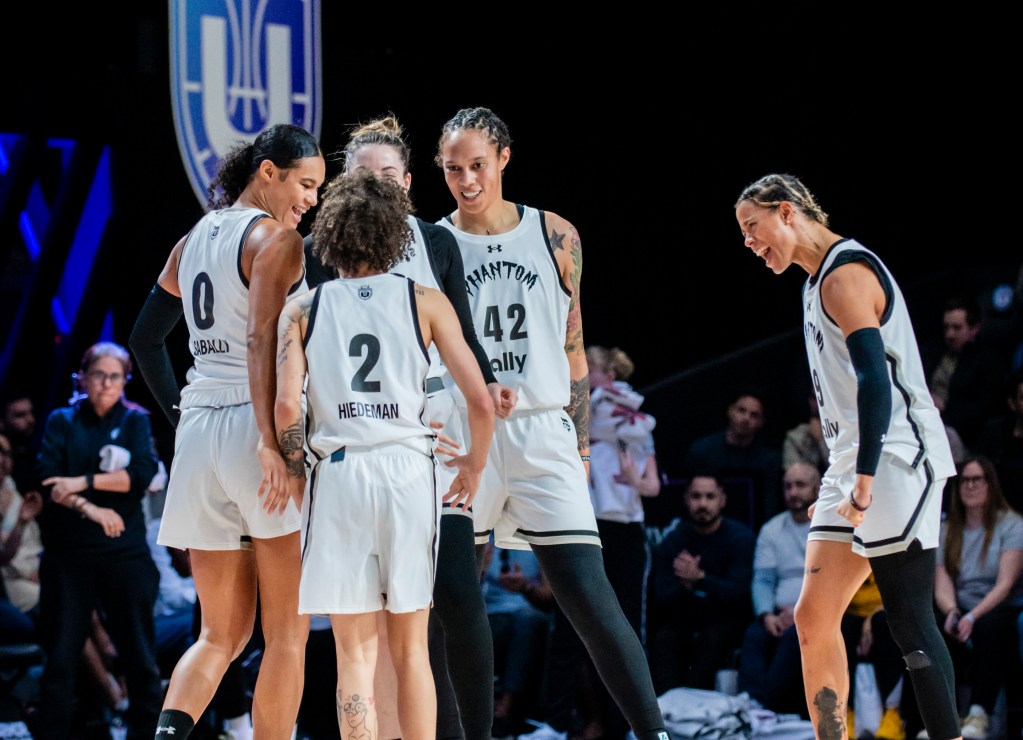 Players gather on the court during an Unrivaled game