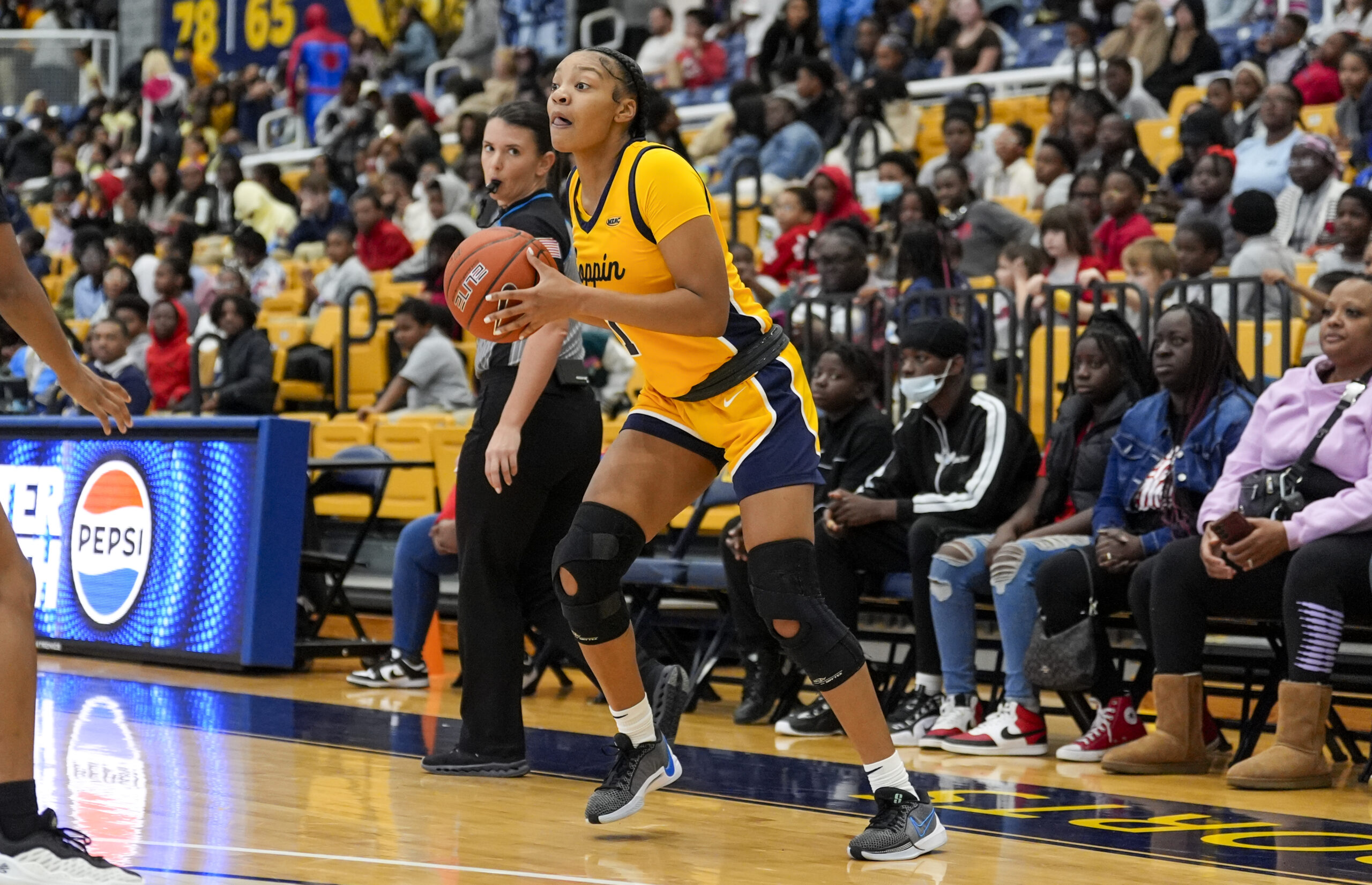Coppin State's Cire Worley looks o make a pass in a game against Saint Francis. (Photo credit: TagTheShooter/Coppin State Athletics)