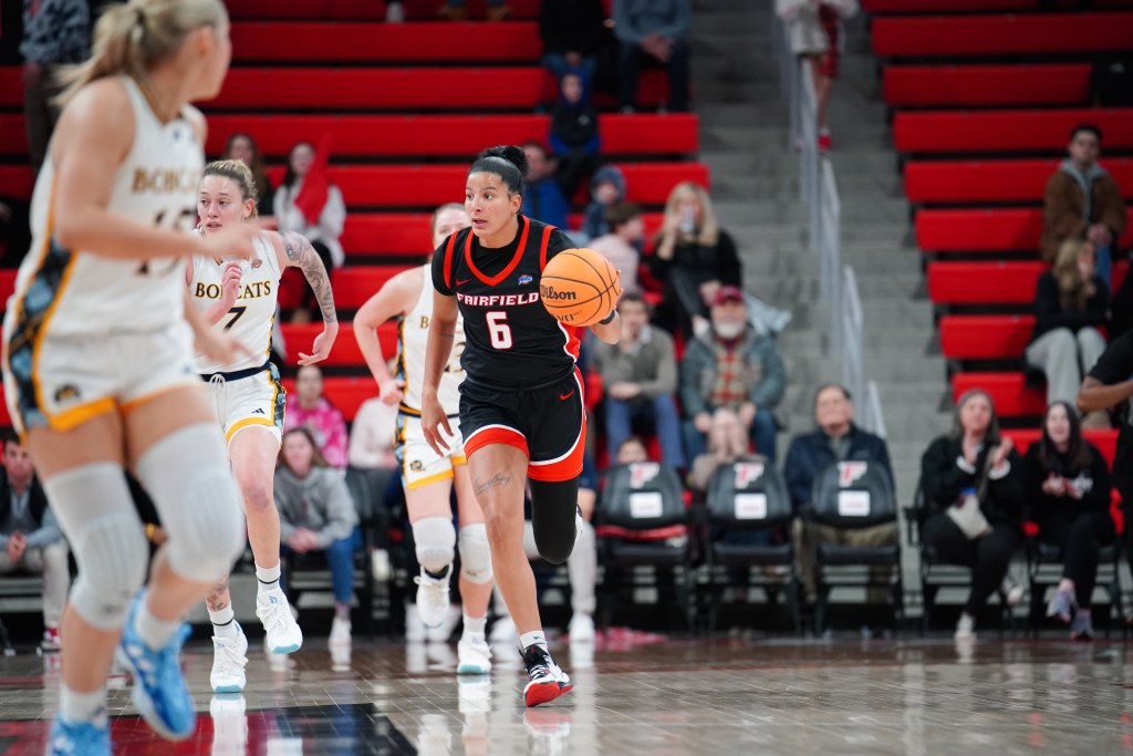Fairfield guard Izabela Nicoletti Leite dribbles the basketball with her left hand while she looks upcourt.
