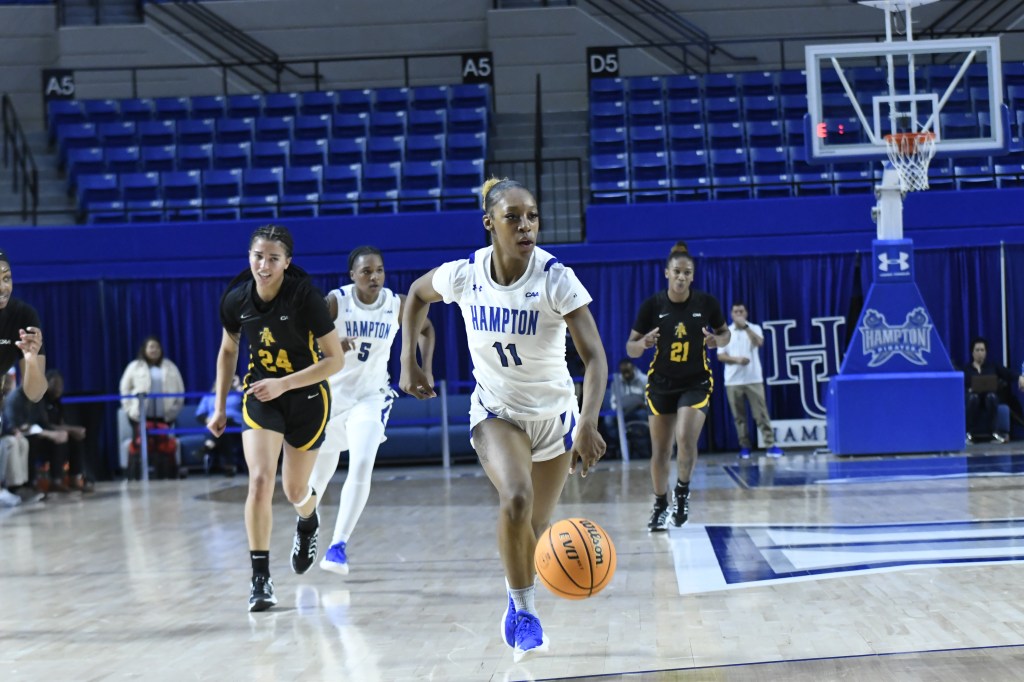 Hampton's Jasha Clinton dribbles the ball in a game against North Carolina A&T on Sunday, January 5, 2025. (Photo credit: Nelson Cheeseman/Hampton Athletics)