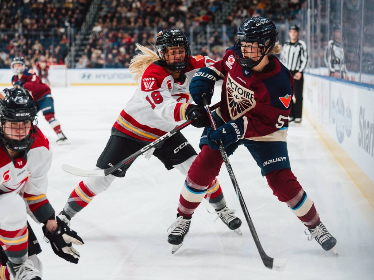 Ottawa Charge and Montreal Victoire battle along boards | Photo Cred: Professional Women's Hockey League