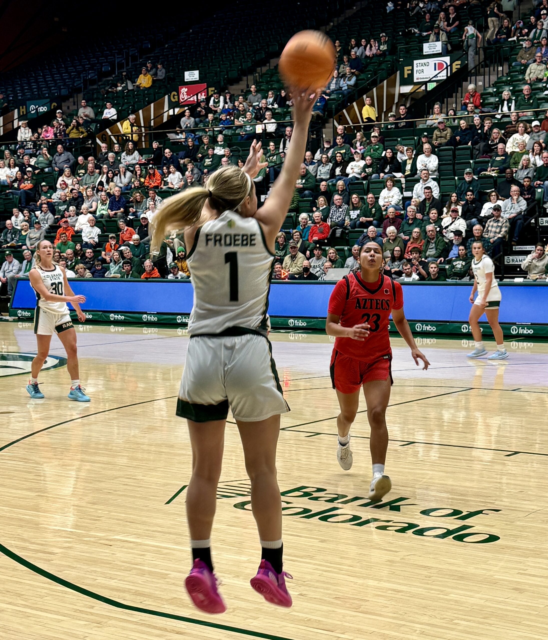 A Colorado State basketball player shoots a three-point shot in a game against San Diego State on Jan. 1, 2025.