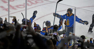 Toronto Sceptres forward Jesse Compher (18) celebrates with teammates and fans