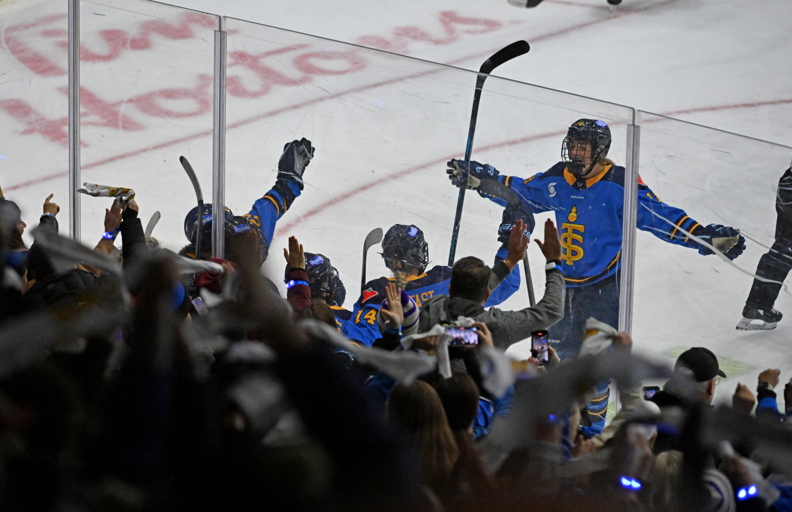 Toronto Sceptres forward Jesse Compher (18) celebrates with teammates and fans