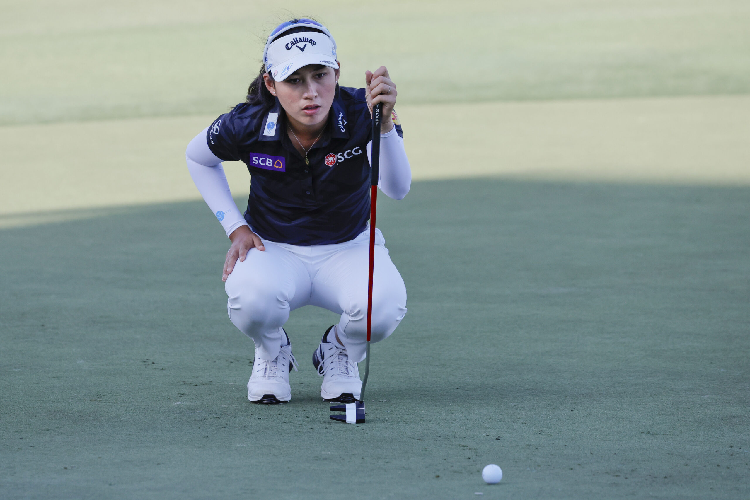 Jeeno Thitikul lines up a putt on the course during the Grant Thornton Invitational.