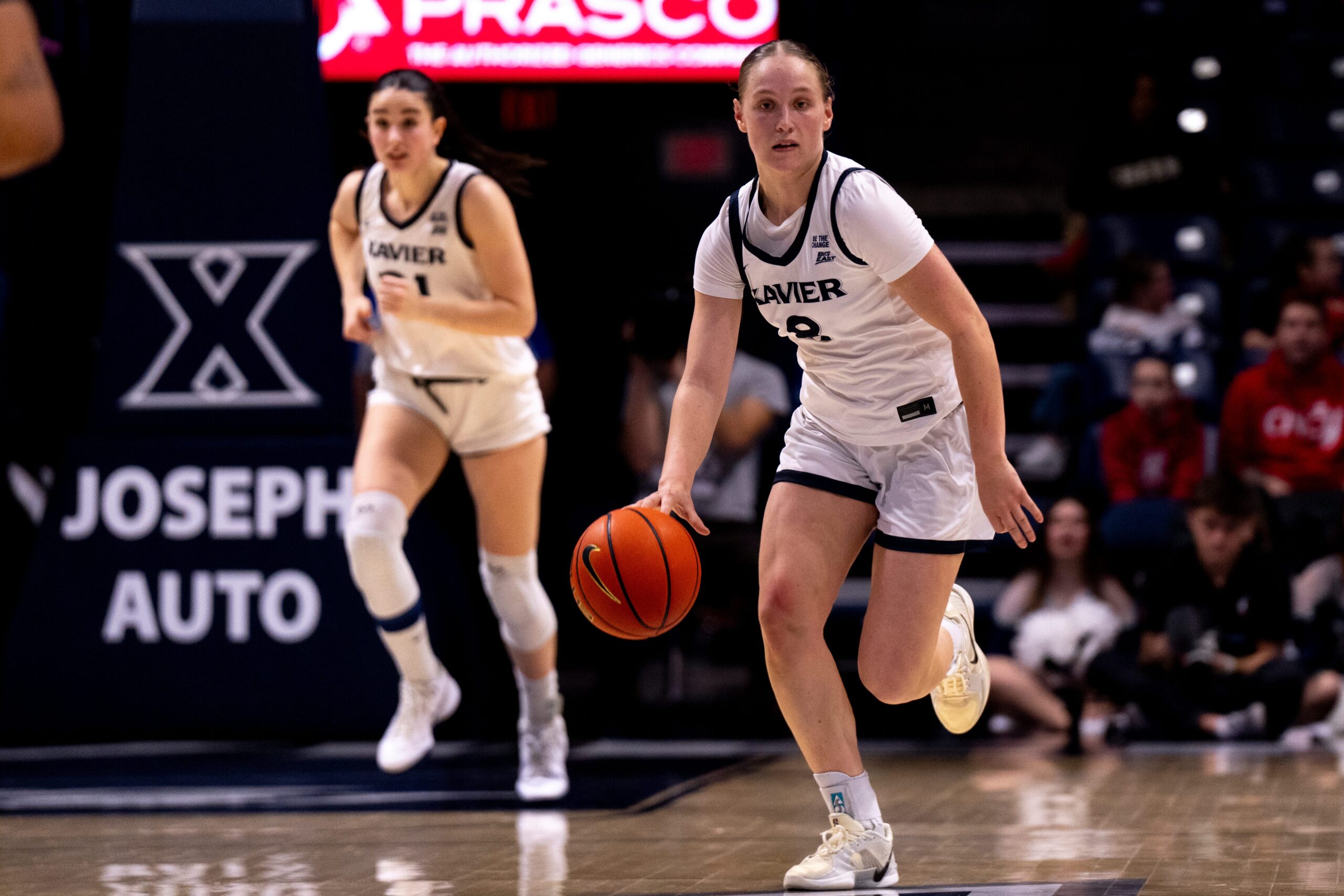 Xavier Musketeers guard Meri Kanerva dribbles the ball up the court with her right hand.