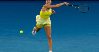 Aryna Sabalenka hits a forehand in her first round match at the 2025 Australian Open