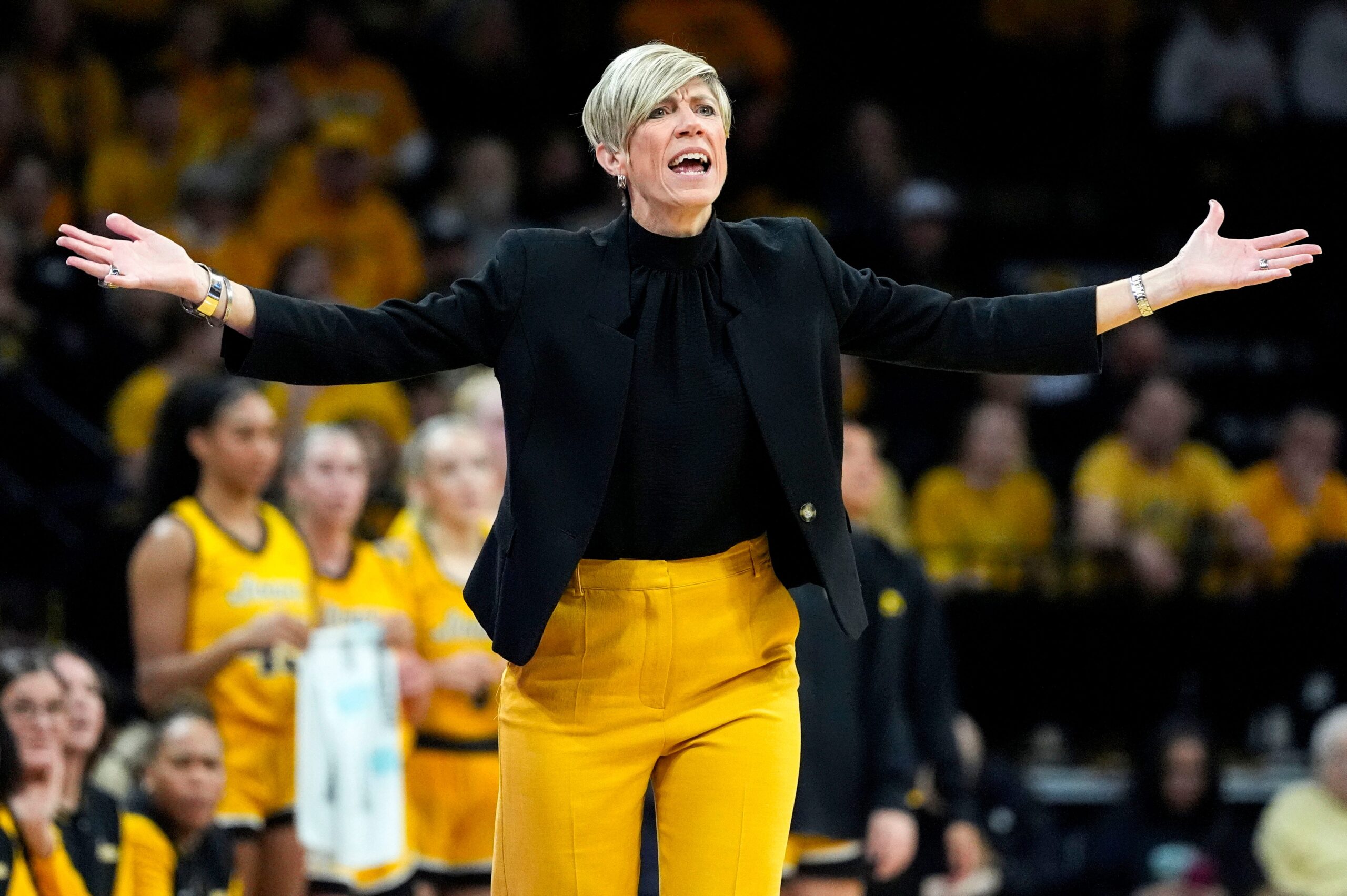 Jan Jensen gestures her arms out after a foul was called on Iowa.