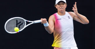 Iga Swiatek hits a forehand in her fourth round match at the 2025 Australian Open