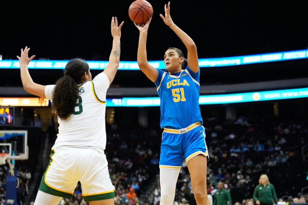 Lauren Betts shoots over a defender.