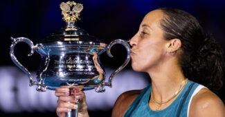 Madison Keys kisses the trophy after capturing the 2025 Australian Open.