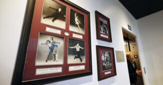 A wall of photos at the Boston Skating Club, which lost 6 skaters in this week's plane crash in Washington, D.C.