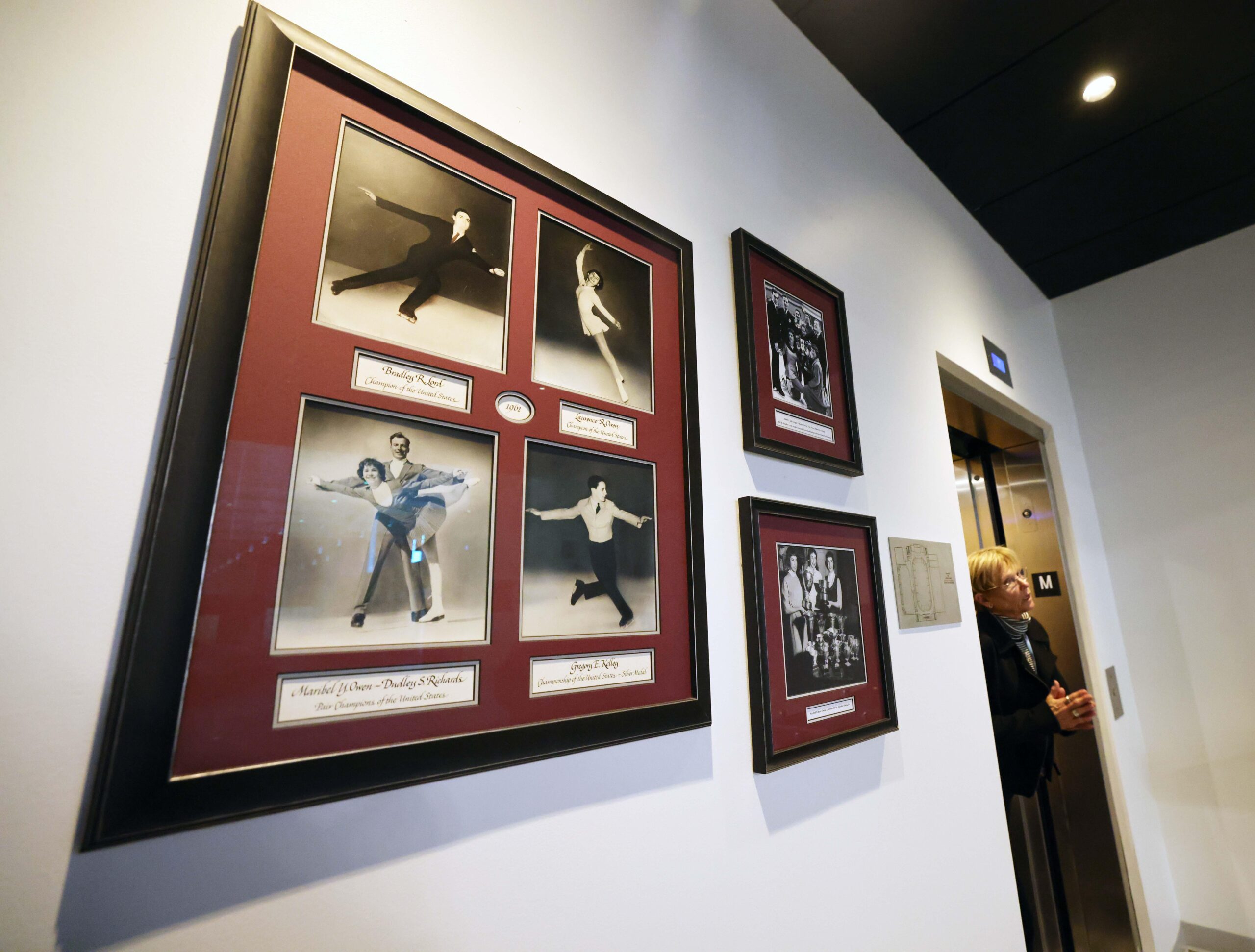 A wall of photos at the Boston Skating Club, which lost 6 skaters in this week's plane crash in Washington, D.C.