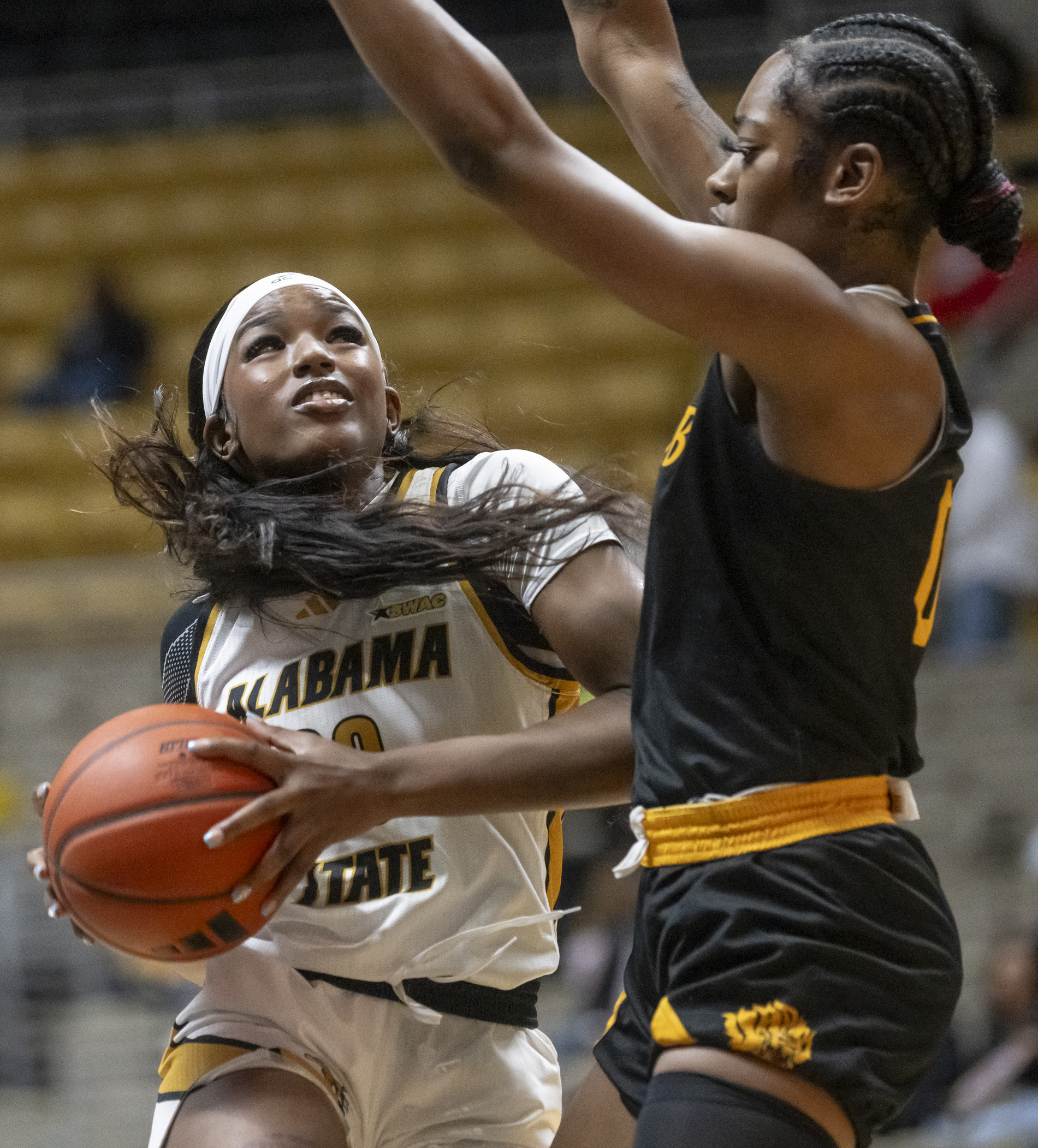 Alabama State's Cordasia Harris goes to the basket in a February 2024 game against the University of Arkansas Pine-Bluff. (Photo credit: David Campbell/Alabama State University