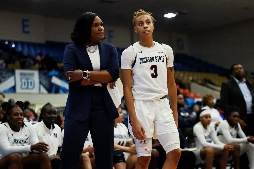 Taleah Dilworth speaks with head coach Margaret Richards during a game against Alabama State.