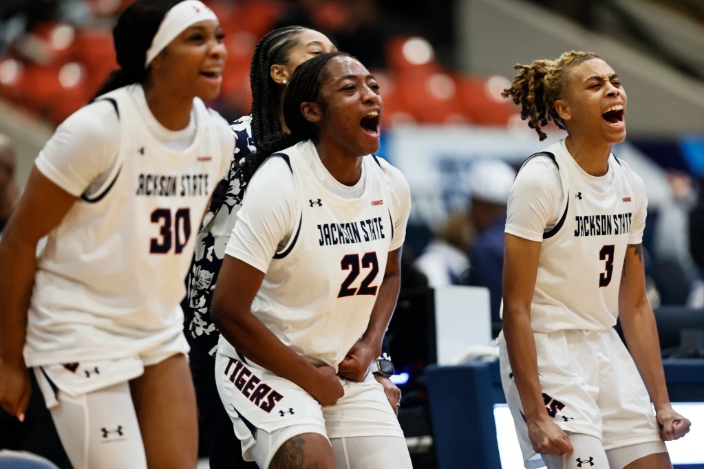 Jackson State's Zoe Cooper, Leianya Massenat, and Taleah Dilworth celebrate during a recent victory. (Photo credit: Jackson State Athletics)