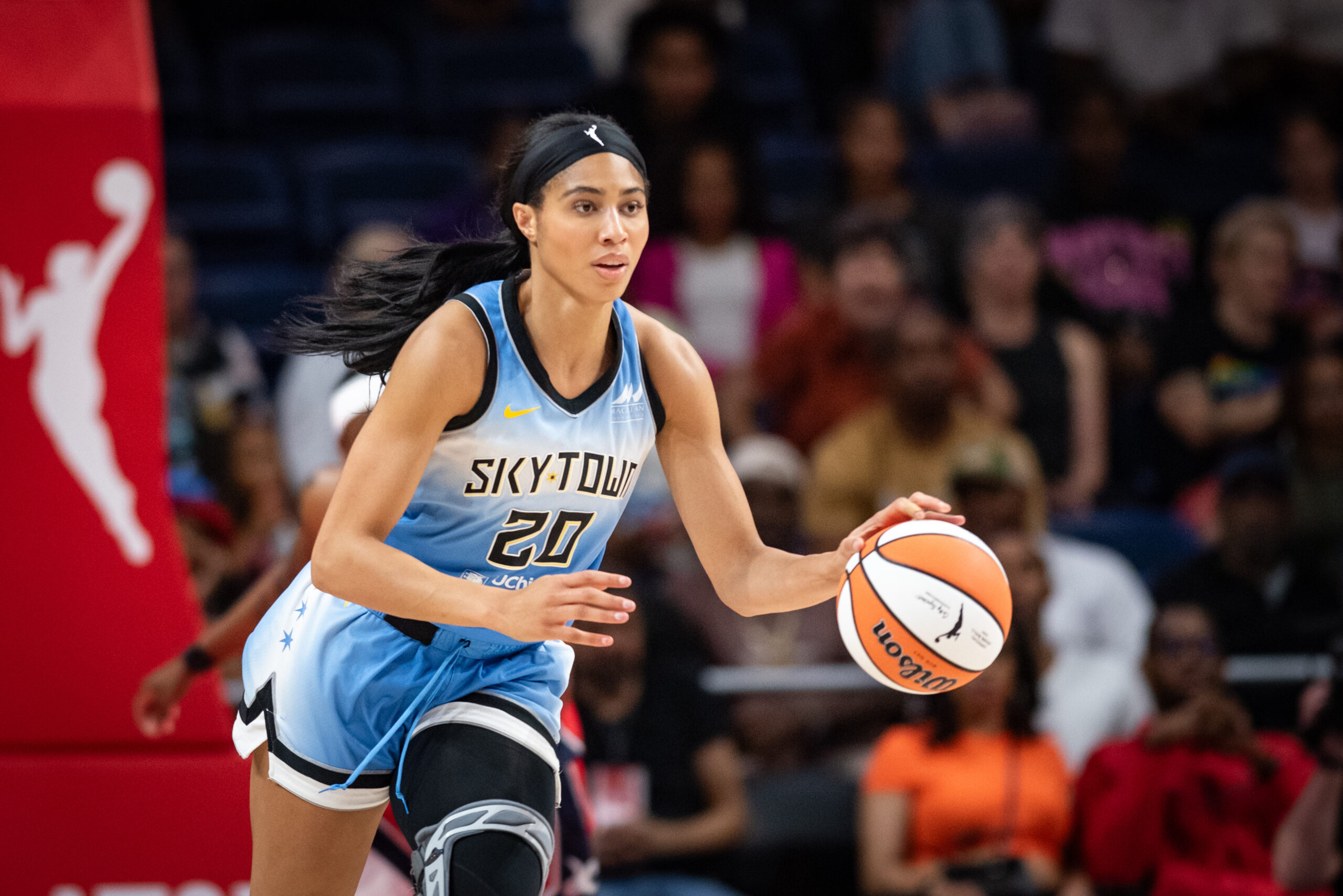 Isabelle Harrison dribbles the ball with her left hand while playing for the Chicago Sky.