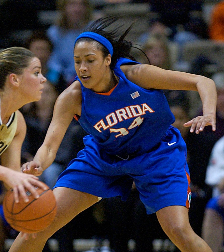 Florida forward Dalila Eshe defends a ball-handler tightly and reaches toward the ball with her right hand.