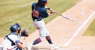 Alex Hugo hits the ball.