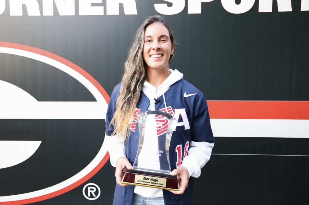 Alex Hugo poses with a trophy.