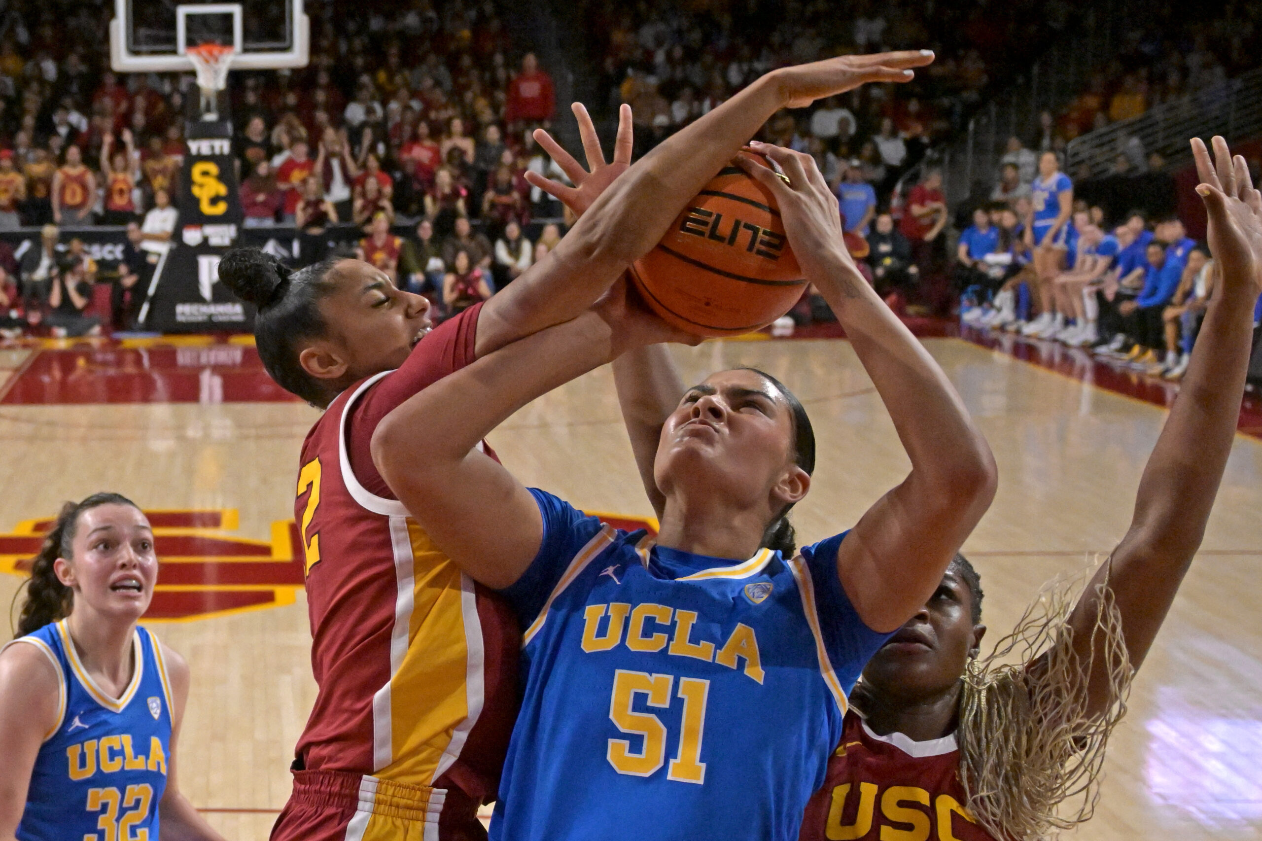 USC guard JuJu watkins contests a shot by UCLA center Lauren Betts in last year's cross-town rivalry.